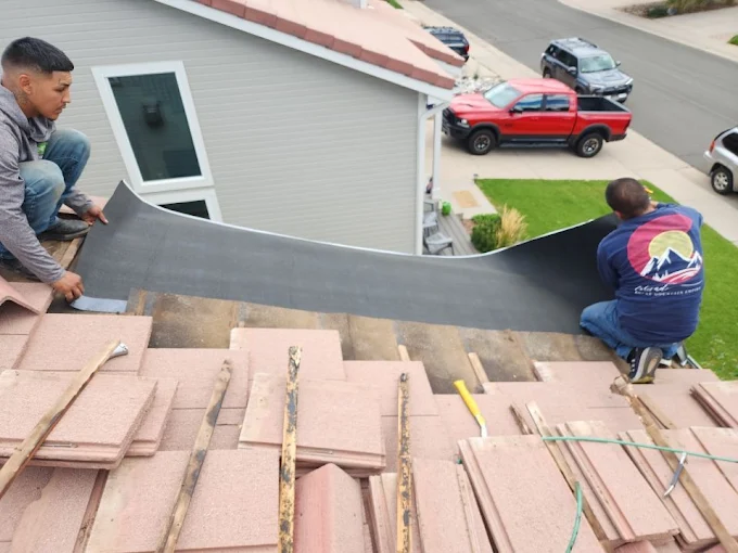 Better Construction Roofing – crew installing new residential shingles